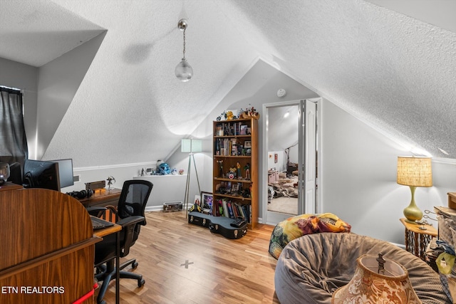 12903 Georgetown Village Ln, Georgetown, TN 37336 - office with a textured ceiling, lofted ceiling, wood finished floors, and baseboards