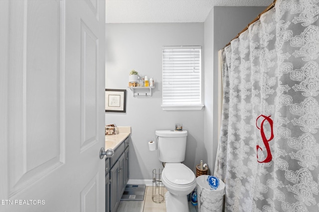 12903 Georgetown Village Ln, Georgetown, TN 37336 - bathroom with toilet, vanity, baseboards, a textured ceiling, and a shower with shower curtain
