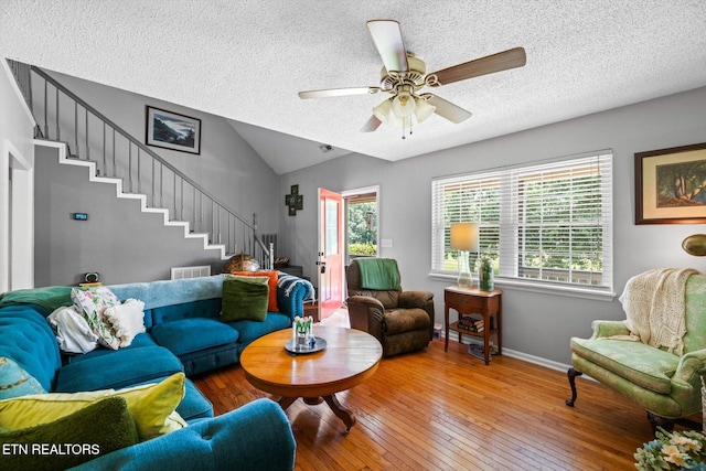 12903 Georgetown Village Ln, Georgetown, TN 37336 - living room featuring stairs, wood-type flooring, a textured ceiling, lofted ceiling, and ceiling fan