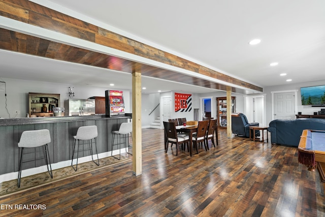 dining space with recessed lighting, wood finished floors, and stairs