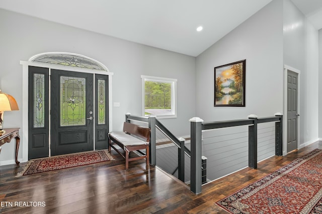 entrance foyer featuring baseboards, wood finished floors, recessed lighting, and high vaulted ceiling