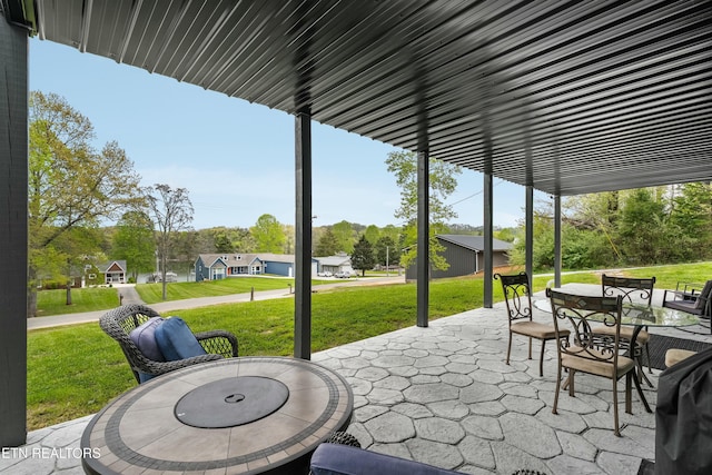 view of patio / terrace featuring outdoor dining area and a residential view