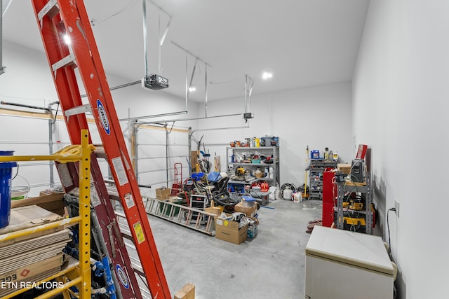garage featuring a workshop area and a garage door opener
