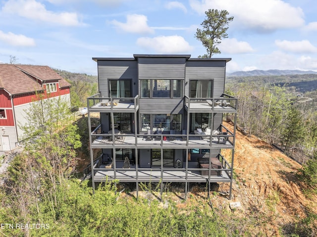 896 Chalet Village Blvd, Gatlinburg, TN 37738 - rear view of house featuring a mountain view and a balcony