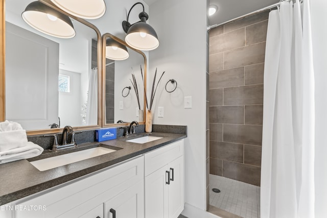 896 Chalet Village Blvd, Gatlinburg, TN 37738 - bathroom with a tile shower, double vanity, and a sink