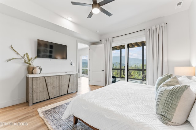 896 Chalet Village Blvd, Gatlinburg, TN 37738 - bedroom with light wood-type flooring, baseboards, a ceiling fan, visible vents, and access to exterior
