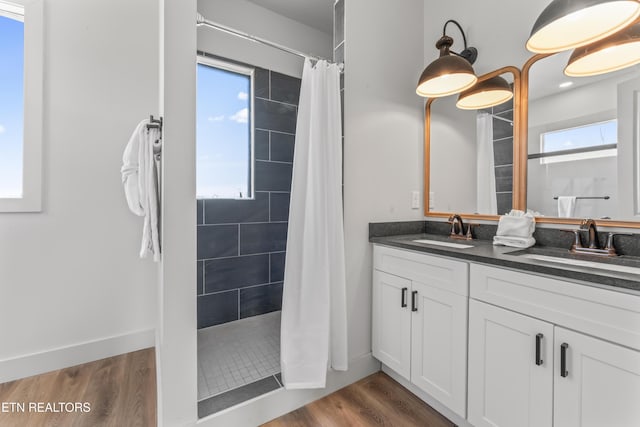896 Chalet Village Blvd, Gatlinburg, TN 37738 - bathroom featuring a sink, a tile shower, and a wealth of natural light
