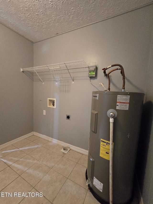 laundry room featuring electric water heater, hookup for a washing machine, electric dryer hookup, laundry area, and light tile patterned floors