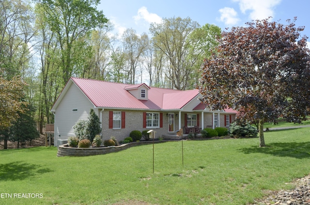 76 Sundrop Ln, Crossville, TN 38571 - ranch-style house with brick siding, a metal roof, and a front yard