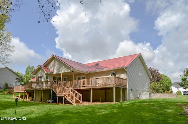 76 Sundrop Ln, Crossville, TN 38571 - back of property with stairs, a deck, a lawn, and a metal roof