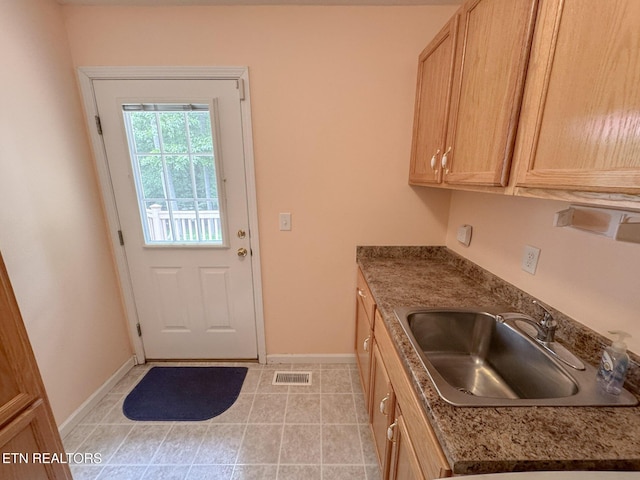 76 Sundrop Ln, Crossville, TN 38571 - kitchen featuring light tile patterned floors and light brown cabinetry