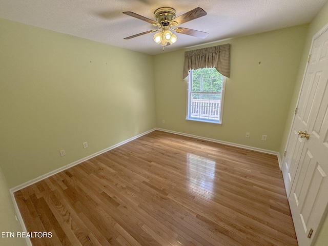 76 Sundrop Ln, Crossville, TN 38571 - empty room with light wood-type flooring, ceiling fan, and a textured ceiling