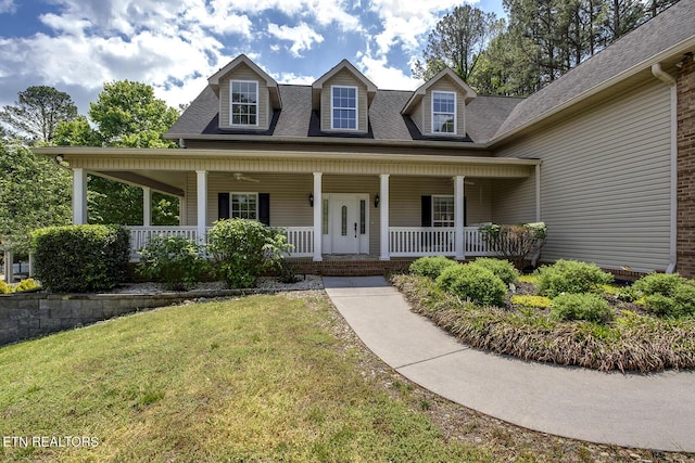 100 Coyatee Cir, Loudon, TN 37774 - view of front facade with covered porch, a shingled roof, and a front yard