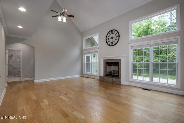 100 Coyatee Cir, Loudon, TN 37774 - unfurnished living room featuring ceiling fan, visible vents, ornamental molding, and high vaulted ceiling