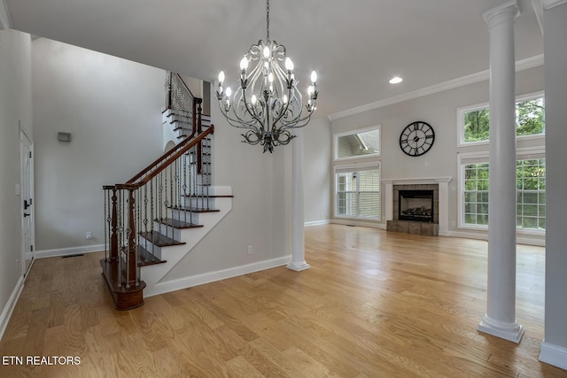 100 Coyatee Cir, Loudon, TN 37774 - unfurnished living room with recessed lighting, baseboards, light wood finished floors, stairs, and crown molding