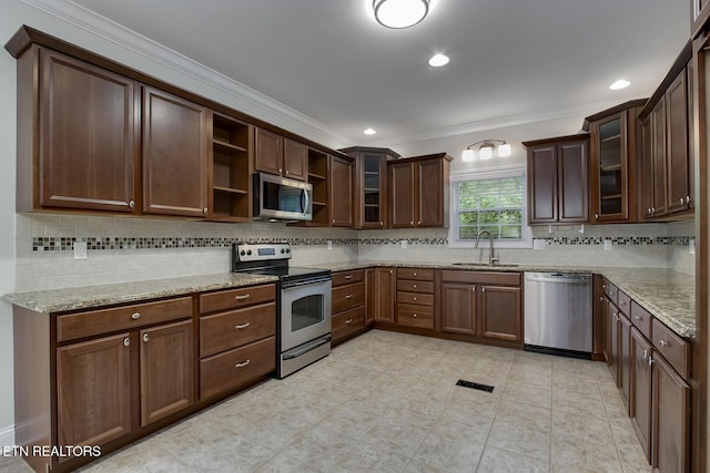 100 Coyatee Cir, Loudon, TN 37774 - kitchen featuring crown molding, tasteful backsplash, open shelves, and appliances with stainless steel finishes