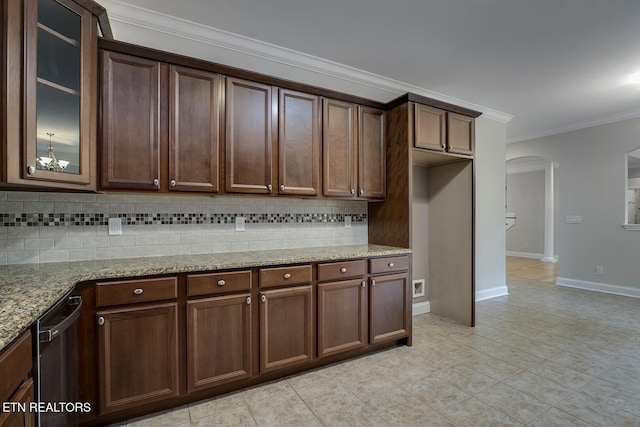 100 Coyatee Cir, Loudon, TN 37774 - kitchen featuring glass insert cabinets, ornamental molding, light stone counters, arched walkways, and backsplash