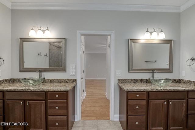 100 Coyatee Cir, Loudon, TN 37774 - bathroom featuring tile patterned floors, baseboards, ornamental molding, and a sink