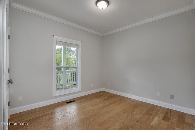 100 Coyatee Cir, Loudon, TN 37774 - unfurnished room featuring crown molding, light wood-style floors, visible vents, and baseboards