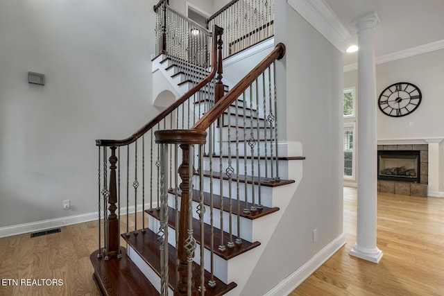 100 Coyatee Cir, Loudon, TN 37774 - staircase featuring crown molding, baseboards, ornate columns, and wood finished floors