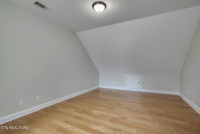 100 Coyatee Cir, Loudon, TN 37774 - bonus room featuring baseboards, light wood finished floors, visible vents, and vaulted ceiling