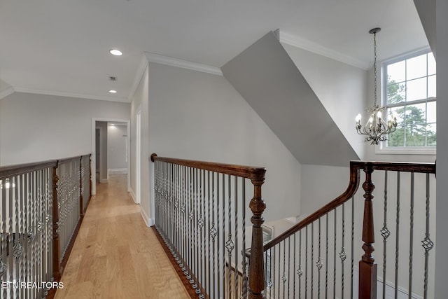 100 Coyatee Cir, Loudon, TN 37774 - hall featuring ornamental molding, an upstairs landing, an inviting chandelier, light wood-style flooring, and baseboards