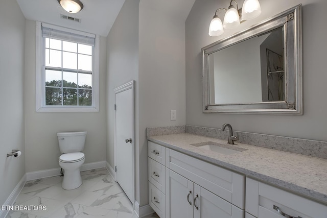 100 Coyatee Cir, Loudon, TN 37774 - bathroom featuring toilet, marble finish floor, vanity, visible vents, and baseboards