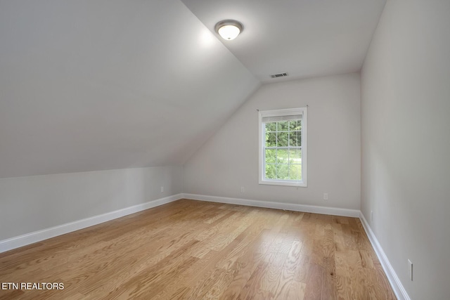 100 Coyatee Cir, Loudon, TN 37774 - additional living space featuring lofted ceiling, baseboards, light wood-style flooring, and visible vents