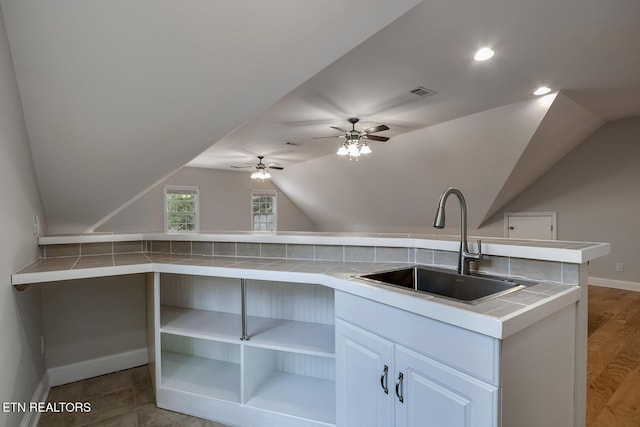 100 Coyatee Cir, Loudon, TN 37774 - kitchen featuring a sink, open shelves, tile counters, baseboards, and lofted ceiling