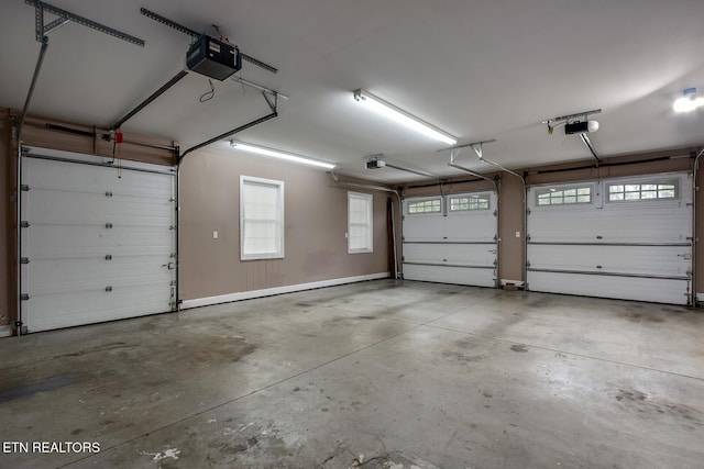 100 Coyatee Cir, Loudon, TN 37774 - garage featuring a garage door opener
