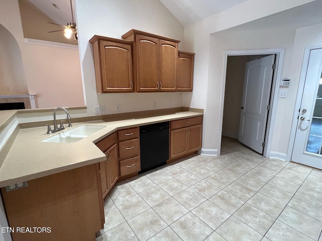 kitchen with a sink, light tile patterned floors, light countertops, lofted ceiling, and black dishwasher