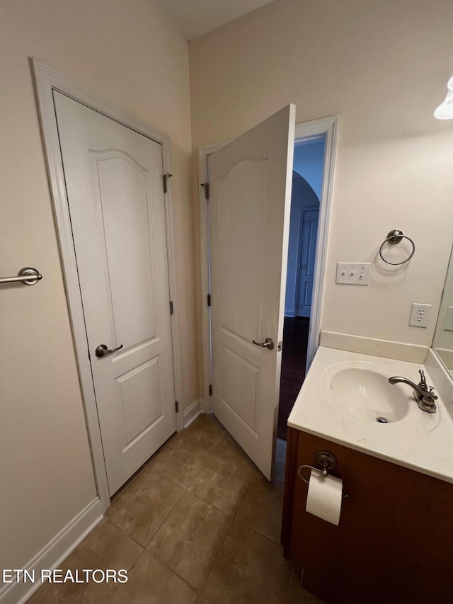 bathroom with vanity and tile patterned flooring