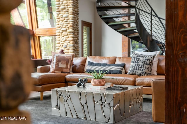 carpeted living room with stairway