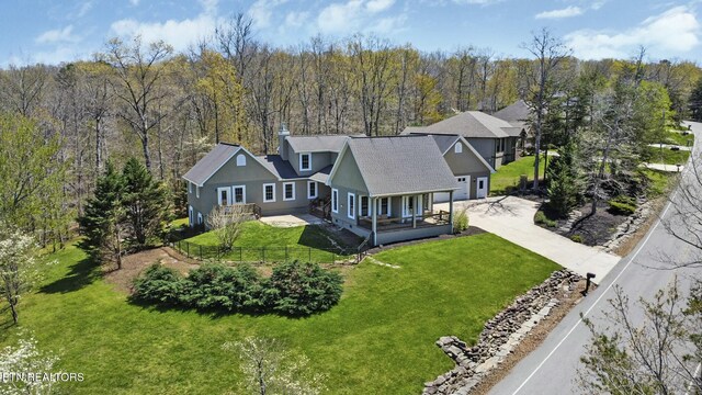drone / aerial view featuring a view of trees