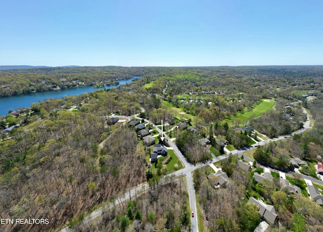 aerial view with a view of trees and a water view