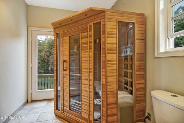 view of sauna featuring tile patterned floors and baseboards