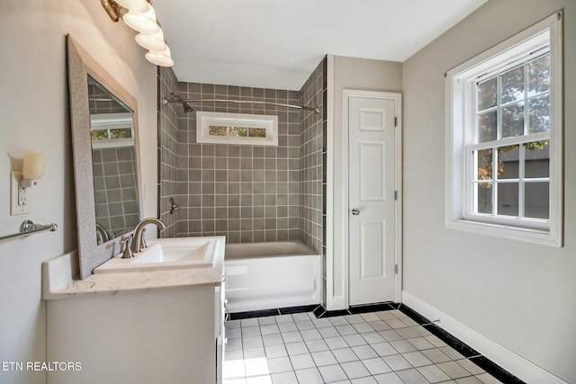 full bathroom featuring baseboards, tile patterned flooring, vanity, and bathtub / shower combination