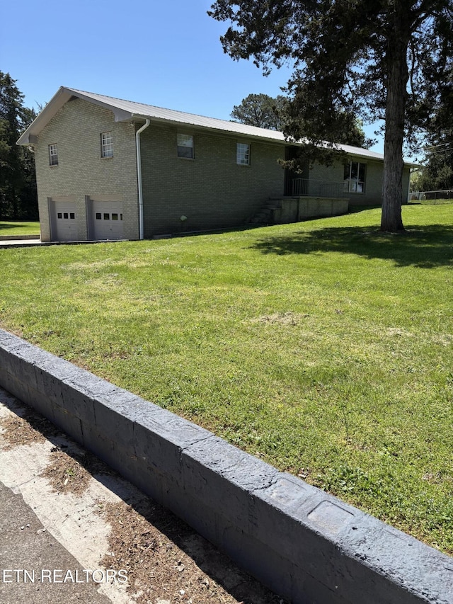 view of yard featuring a garage