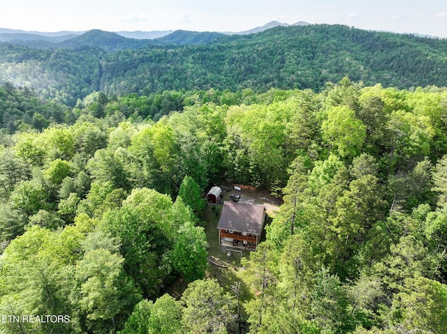 bird's eye view with a mountain view and a wooded view