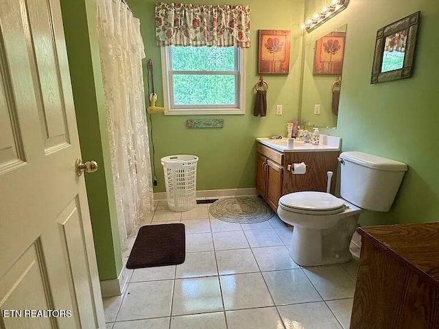 bathroom featuring toilet, a shower with curtain, tile patterned flooring, and vanity