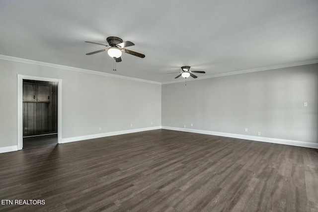 unfurnished room featuring crown molding, a ceiling fan, baseboards, and dark wood-style flooring