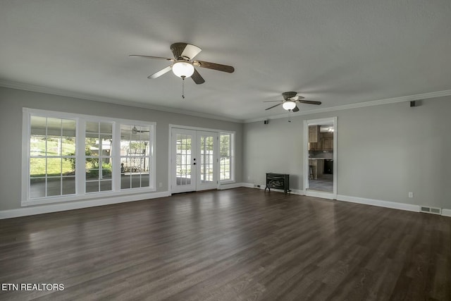 unfurnished living room featuring ceiling fan, baseboards, crown molding, and visible vents