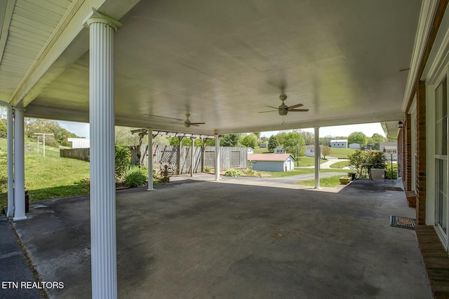 view of patio / terrace with fence and a ceiling fan