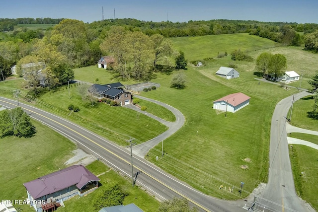 birds eye view of property with a rural view
