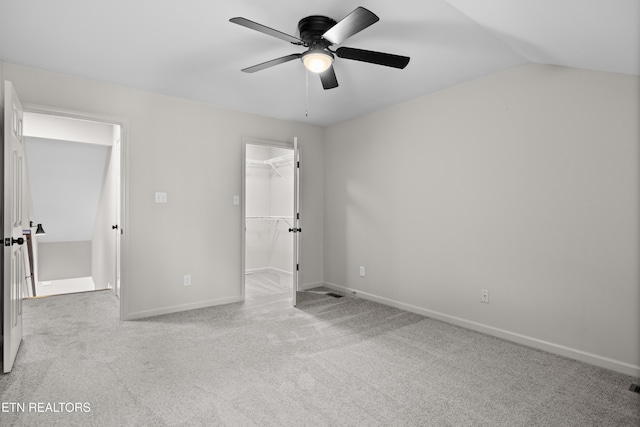 8411 Ivy Green Way, Knoxville, TN 37919 - unfurnished bedroom with lofted ceiling, a walk in closet, a closet, baseboards, and carpet flooring