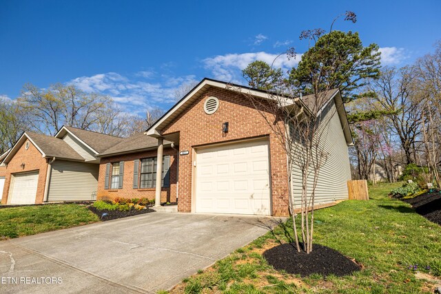 8411 Ivy Green Way, Knoxville, TN 37919 - ranch-style home featuring a garage, brick siding, a front lawn, and driveway