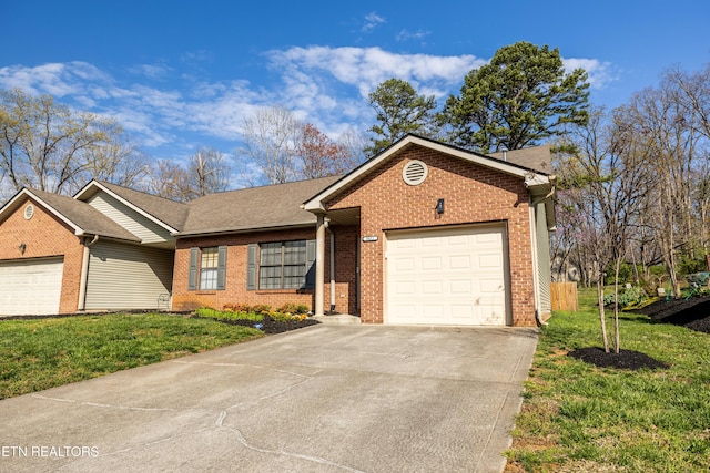8411 Ivy Green Way, Knoxville, TN 37919 - ranch-style house featuring an attached garage, a front lawn, brick siding, and concrete driveway