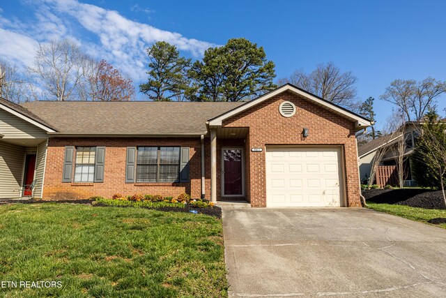 8411 Ivy Green Way, Knoxville, TN 37919 - ranch-style home featuring concrete driveway, a front lawn, an attached garage, brick siding, and roof with shingles