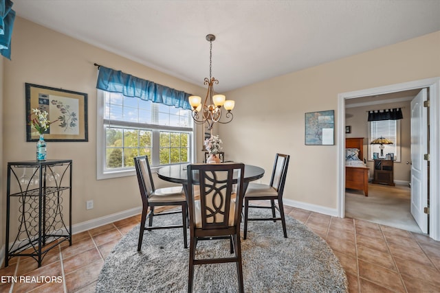 1079 Rarity Bay Pkwy, Vonore, TN 37885 - tiled dining space with a chandelier and baseboards