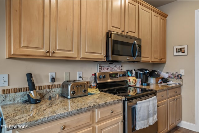 1079 Rarity Bay Pkwy, Vonore, TN 37885 - kitchen featuring light brown cabinetry, a toaster, baseboards, light stone counters, and appliances with stainless steel finishes